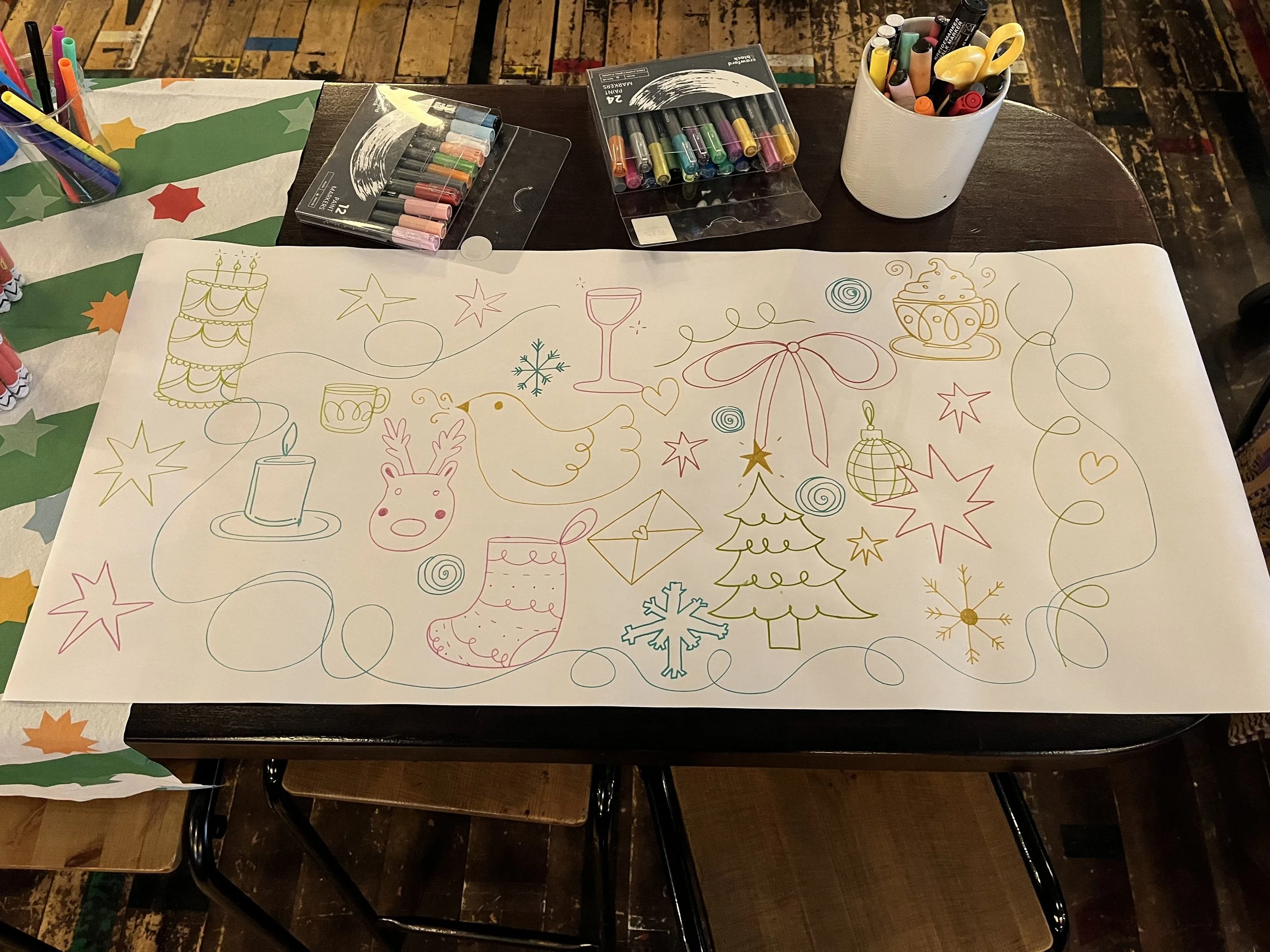 Colouring Sheet for Children to Colour in at work. Hand Drawn text + image using Posca Markers on a Roll of Paper(2025).