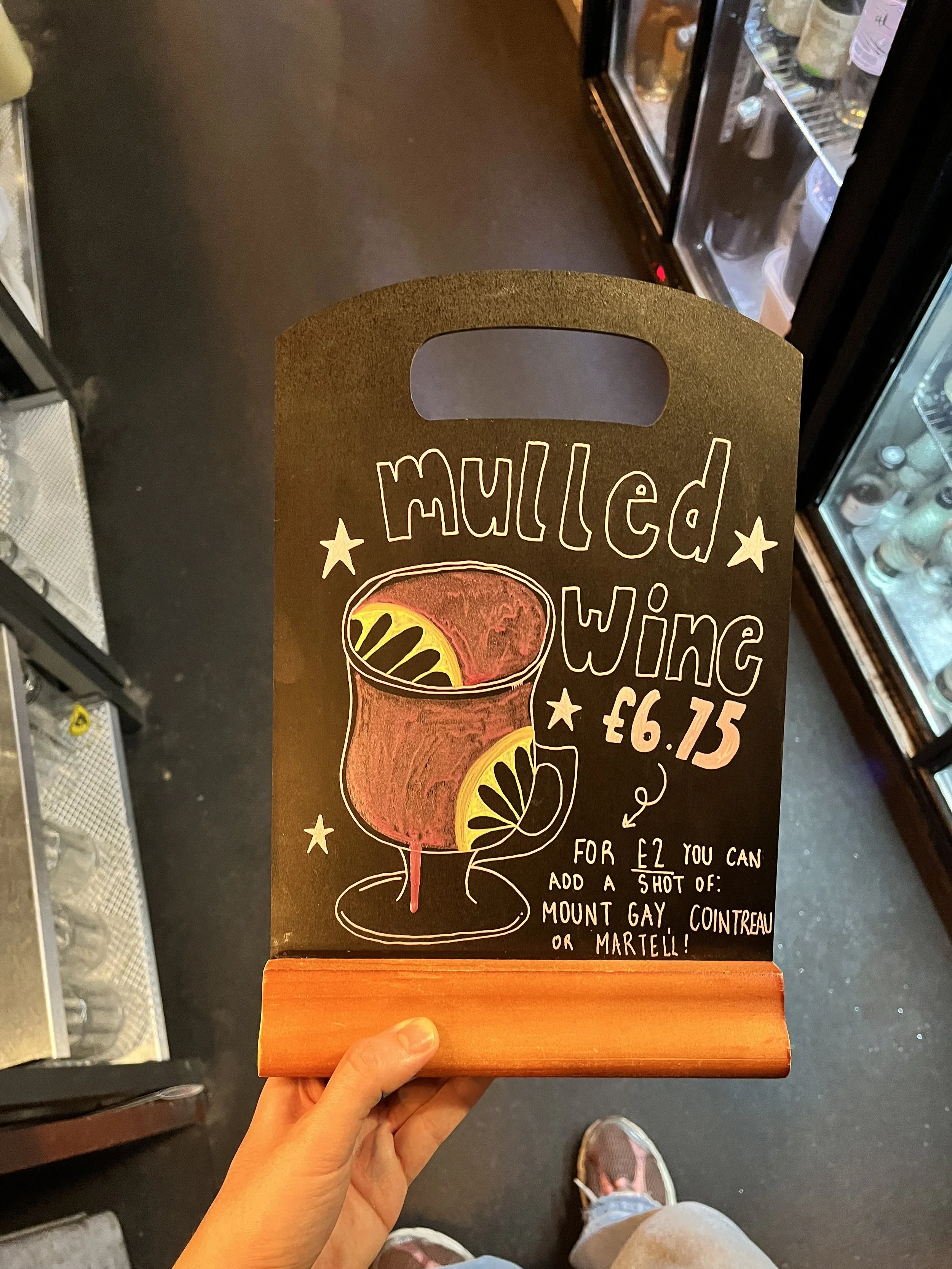 A4 sized Chalkboard promoting 'Mulled Wine'. Hand Drawn text + image using Posca Markers (2025).