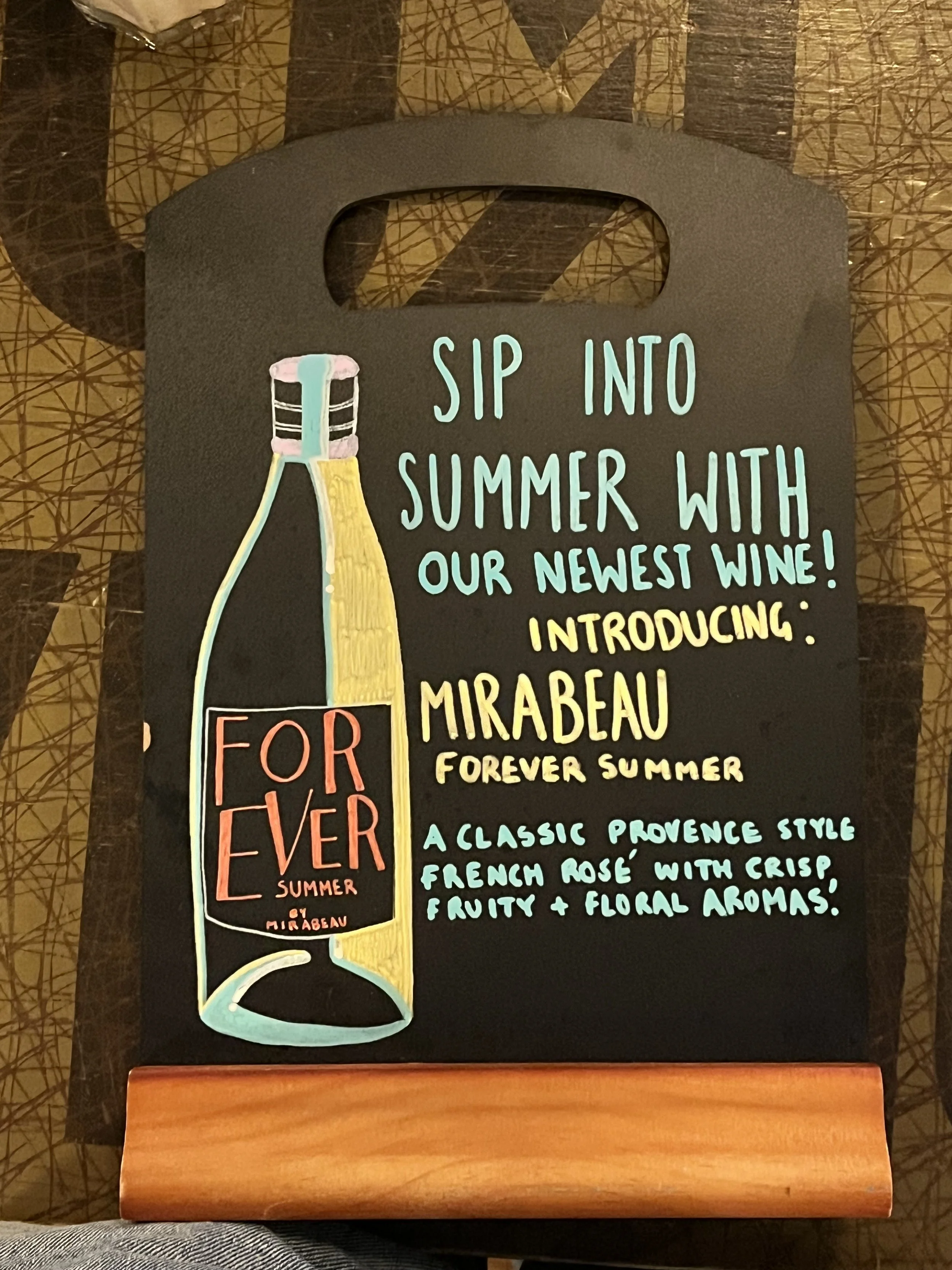 A4 sized Chalkboard promoting 'Mirabeau; Forever Summer, Rose wine'. Hand Drawn text + image using Posca Markers (2025).