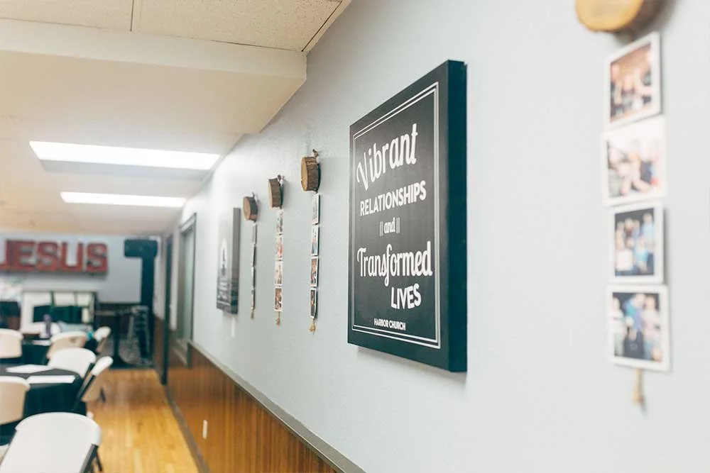 Harbor Church commons wall with pictures and messages on the wall