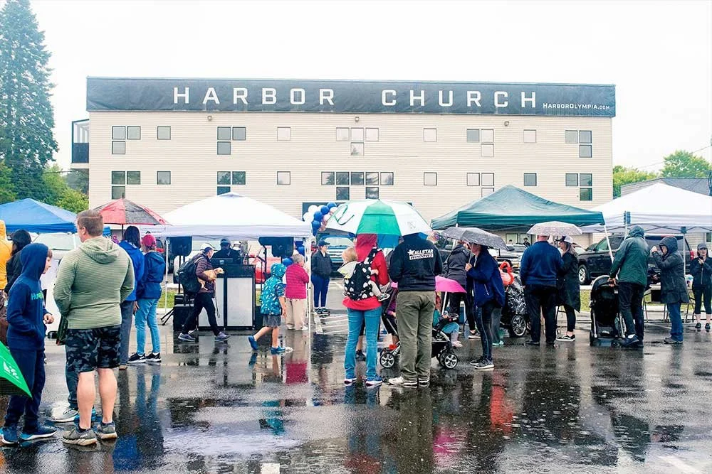 Outdoor event in the rain with umbrellas