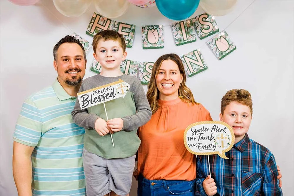 Family smiling and posing at an Easter event at Harbor Church