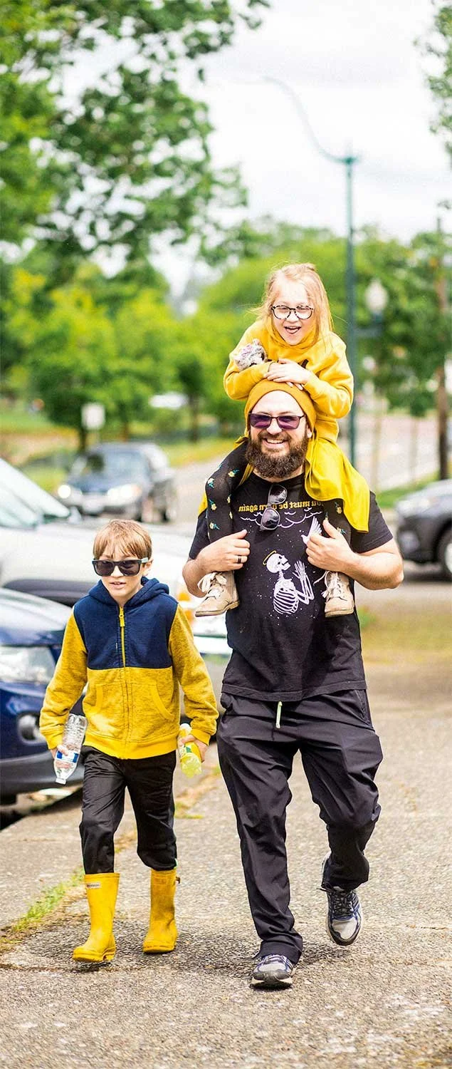 Father and two children walking at Walk for Life event