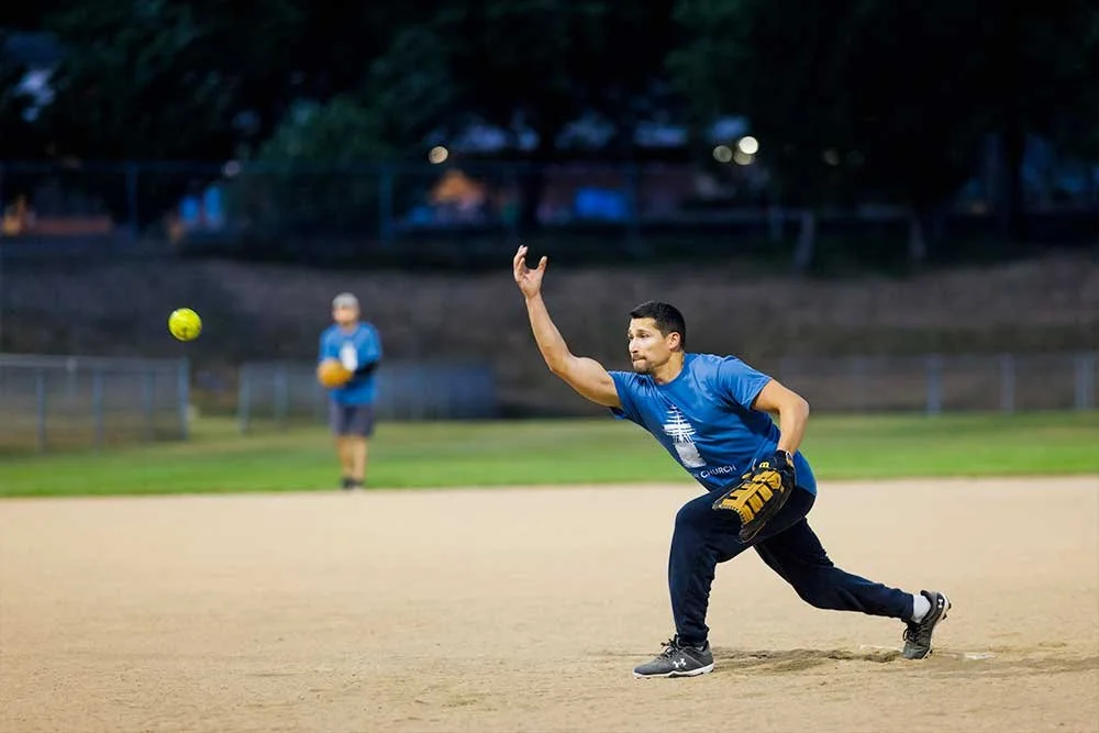 Man pitching at a baseball event