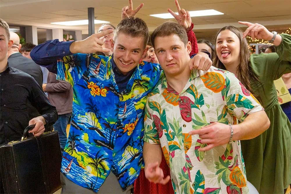 Teenagers horsing around and laughing in a group setting