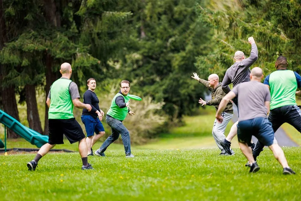 Men playing ultimate frisbee