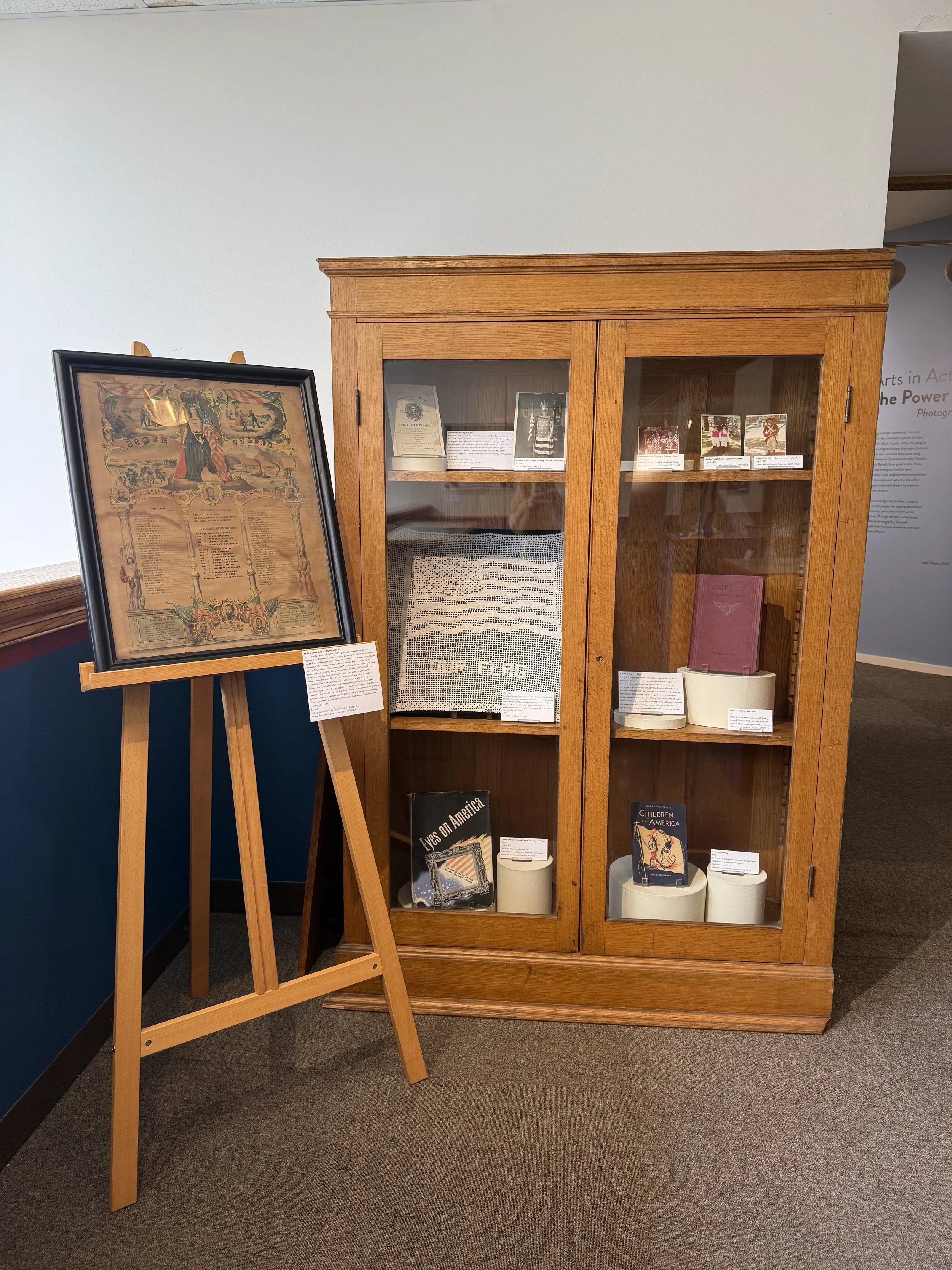 America 250 Exhibit - Display depicting printed, photographed, and crocheted patriotic items from around DeKalb County.