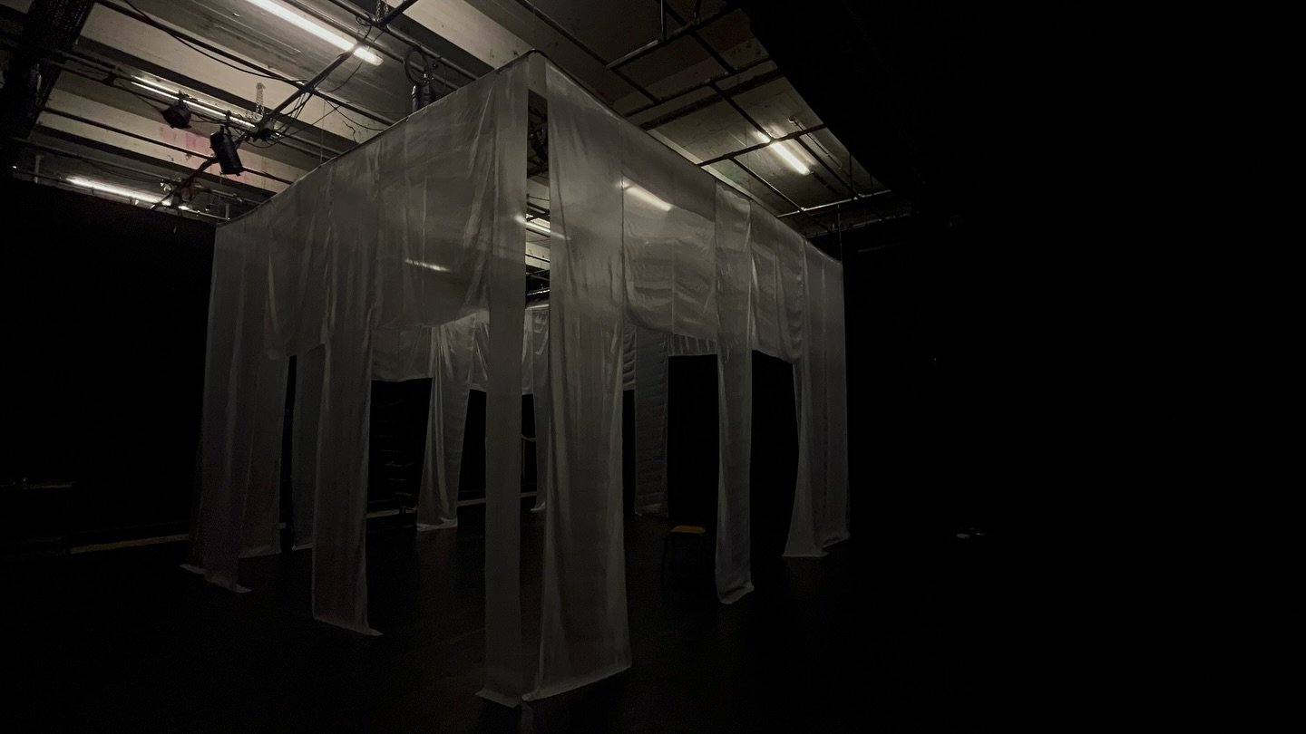 A palazzo courtyard on a small scale, but dismanteling its robustness and loosening up the foundation through the use of fabric. 

Korean tule cut by hand and assembled with melted candles only. Hanging structure out of metal chains and black wool, 2