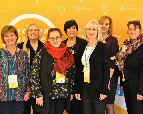 Group of women posing at a women's leadership event