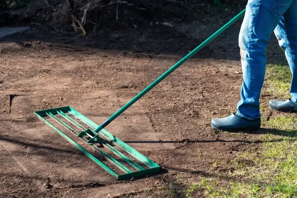 Leveling rake flattening dirt to prepare for sod in American Fork, Utah