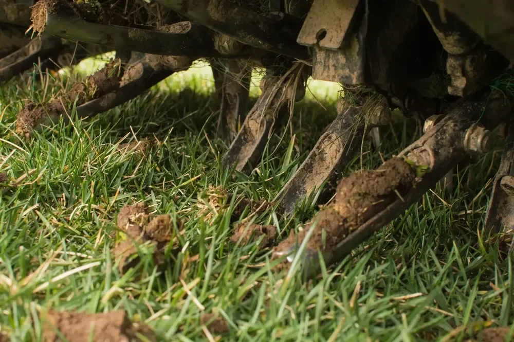 Aerator machine aerating grass in Sandy Utah