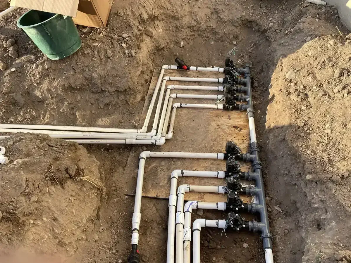 New sprinkler valve manifold being installed in a Utah yard