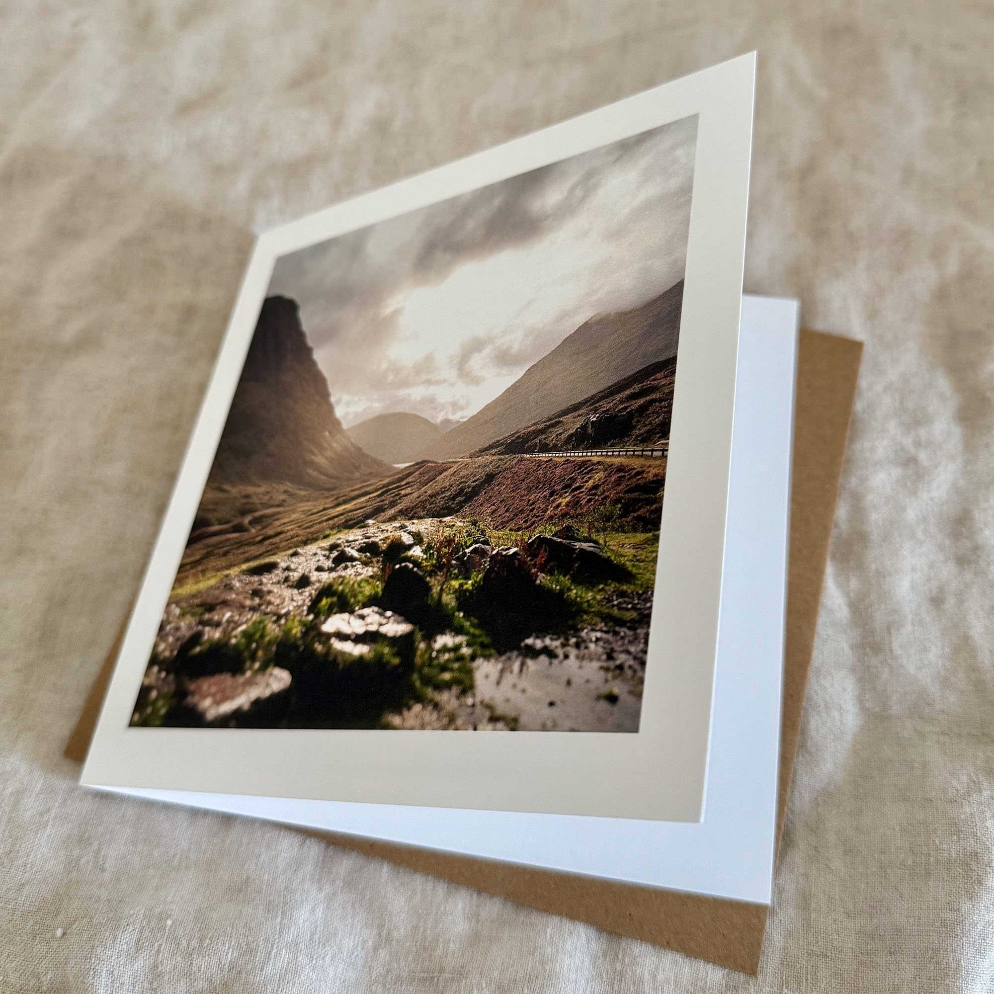 Close-up of Rainy Mountains greeting card showing textured cardstock, blank inside, and print quality.