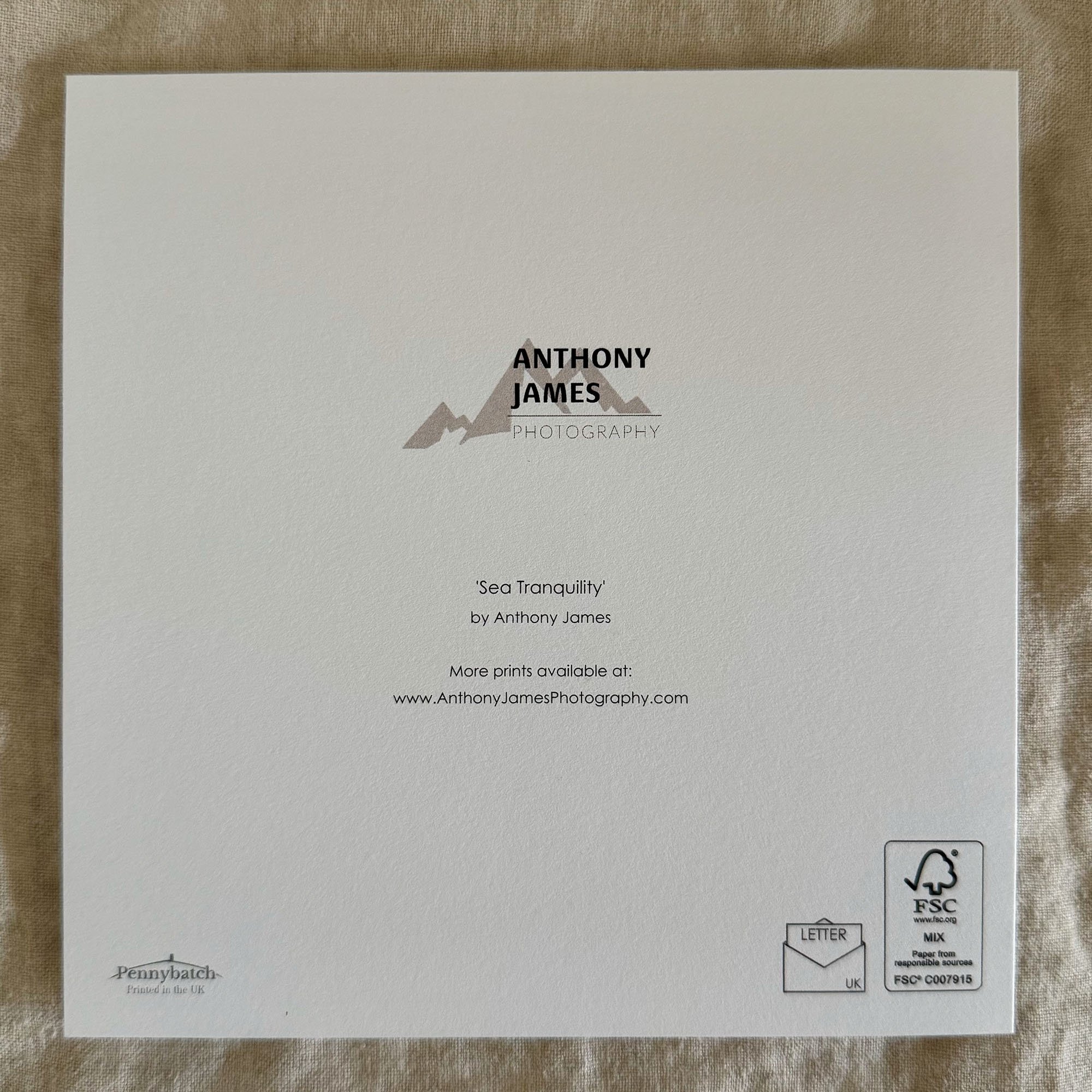 Back of Sea Tranquility greeting card featuring Anthony James Photography branding and eco-friendly materials.