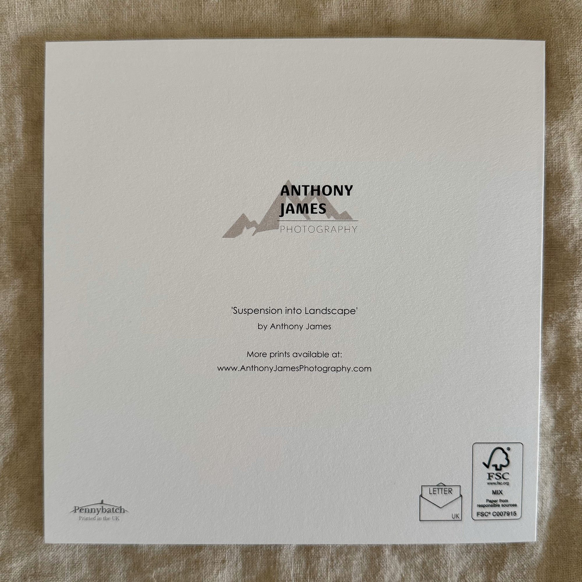 Back of Suspension into Landscape greeting card featuring Anthony James Photography branding and eco-friendly materials.
