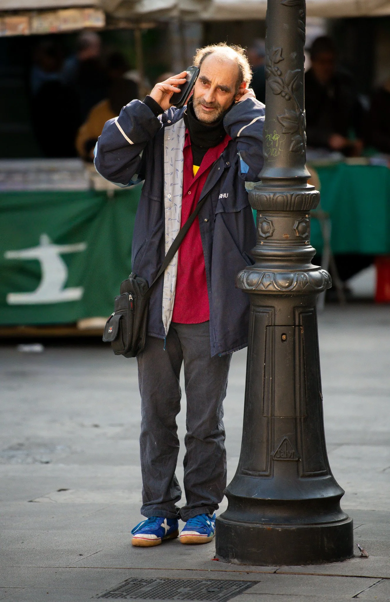 Man holding up post.jpg