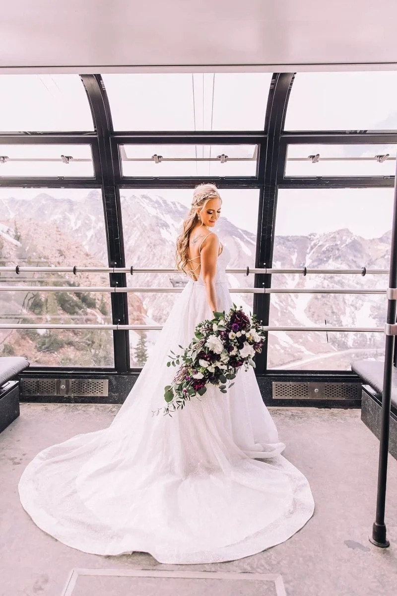 snow-wedding-niki-baldwin-wedding-dress-love-sign-mountain-sunset-winter-wedding-zion-utah_0846-scaled.jpg