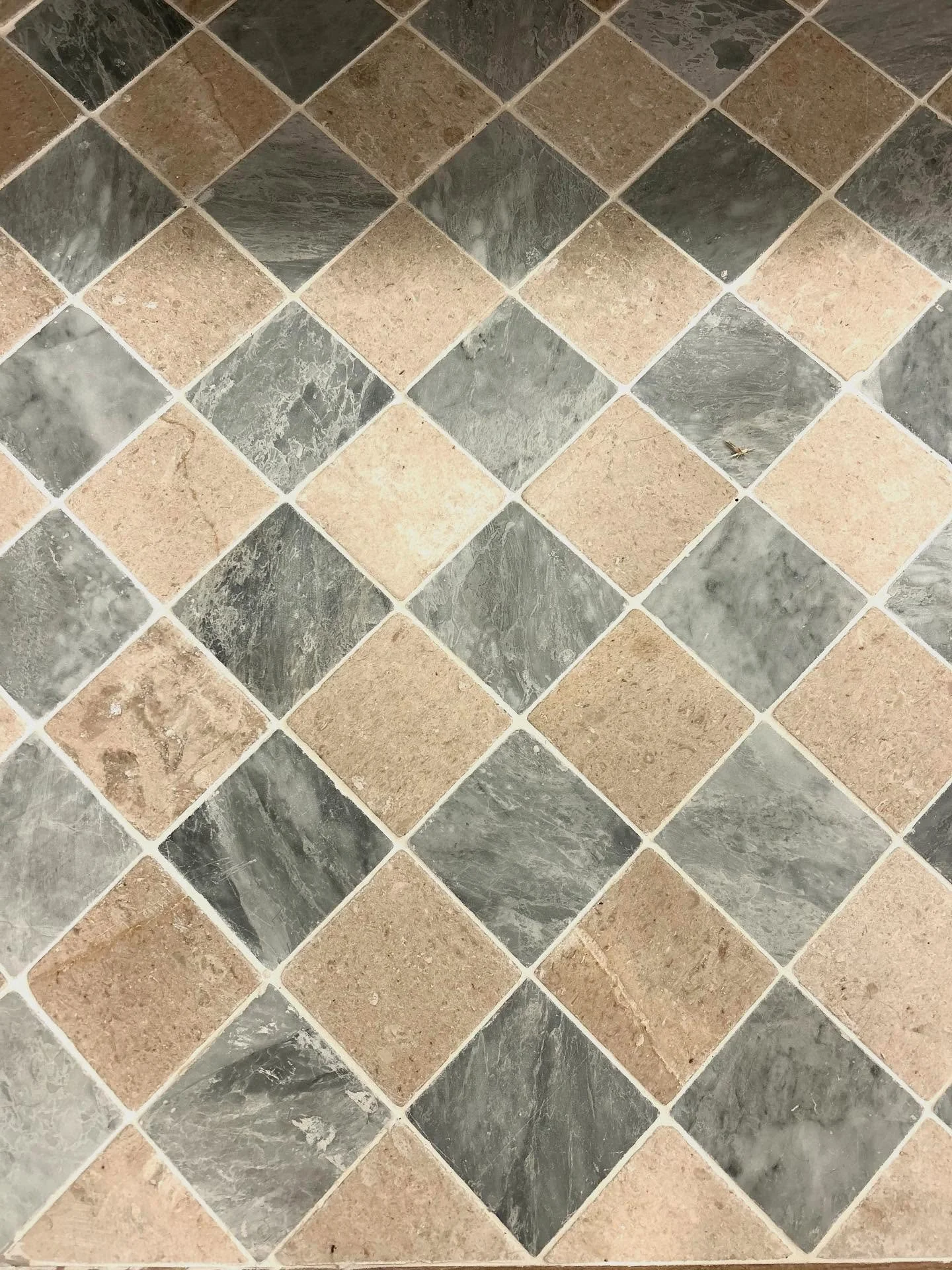 Laundry room limestone tile for the win