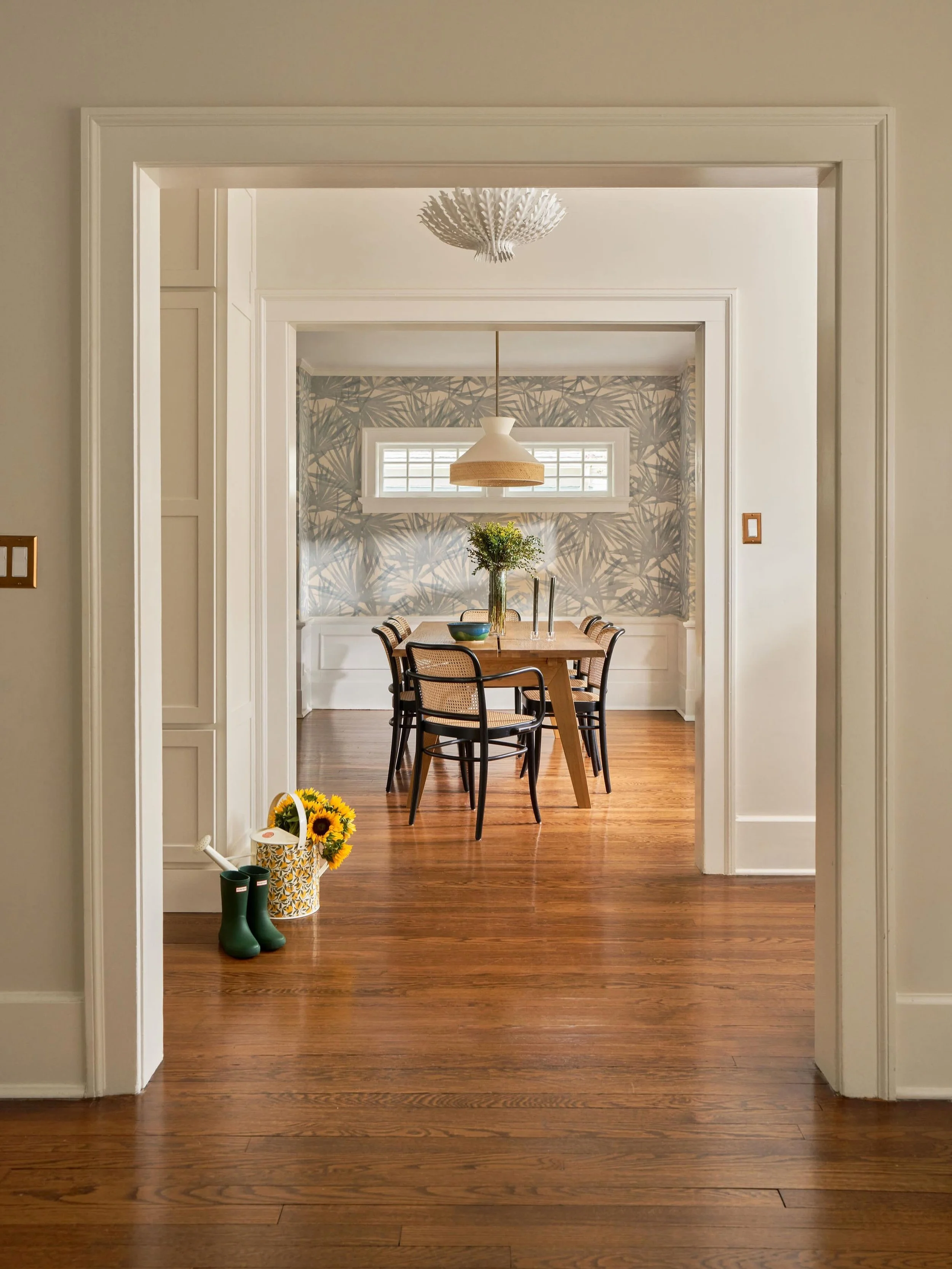 When designing this space, my clients wanted the space to feel bright, open, and welcoming. While they initially weren't looking to invest in a statement fixture, I encouraged them to consider the impact that lighting can have on a space. After much 