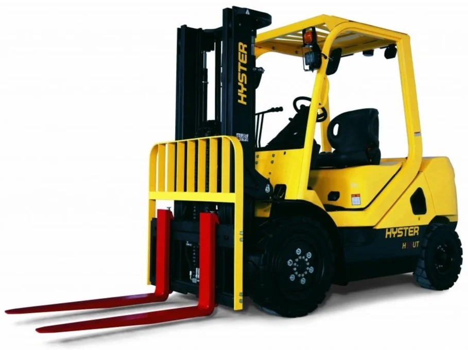 Yellow and black Hyster forklift with red forks, isolated on a white background.