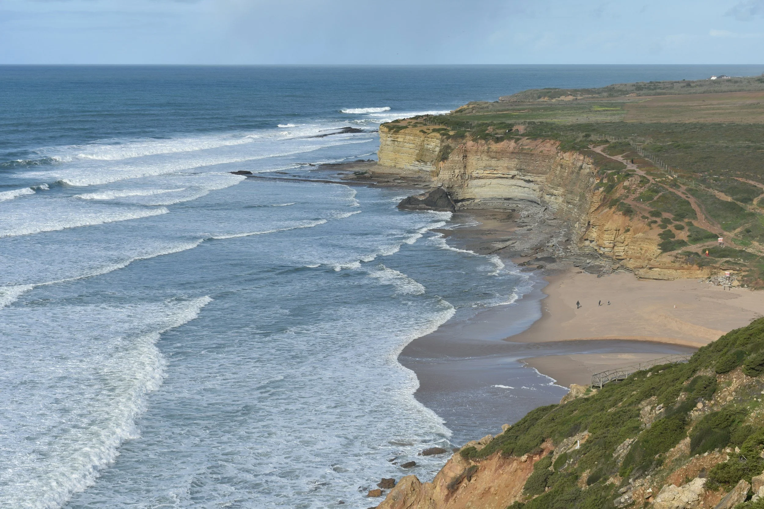 Atlantic coastline in Portugal with cliffs and sandy beaches.