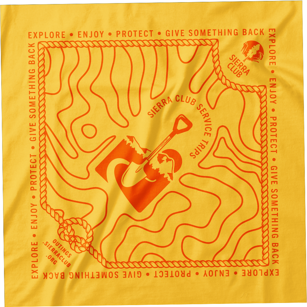 A yellow fabric with orange text and illustrations related to Sierra Club service trips, featuring a topographic map, a shovel, and a mountain logo, with phrases like 'Explore', 'Enjoy', 'Protect', 'Give Something Back'.
