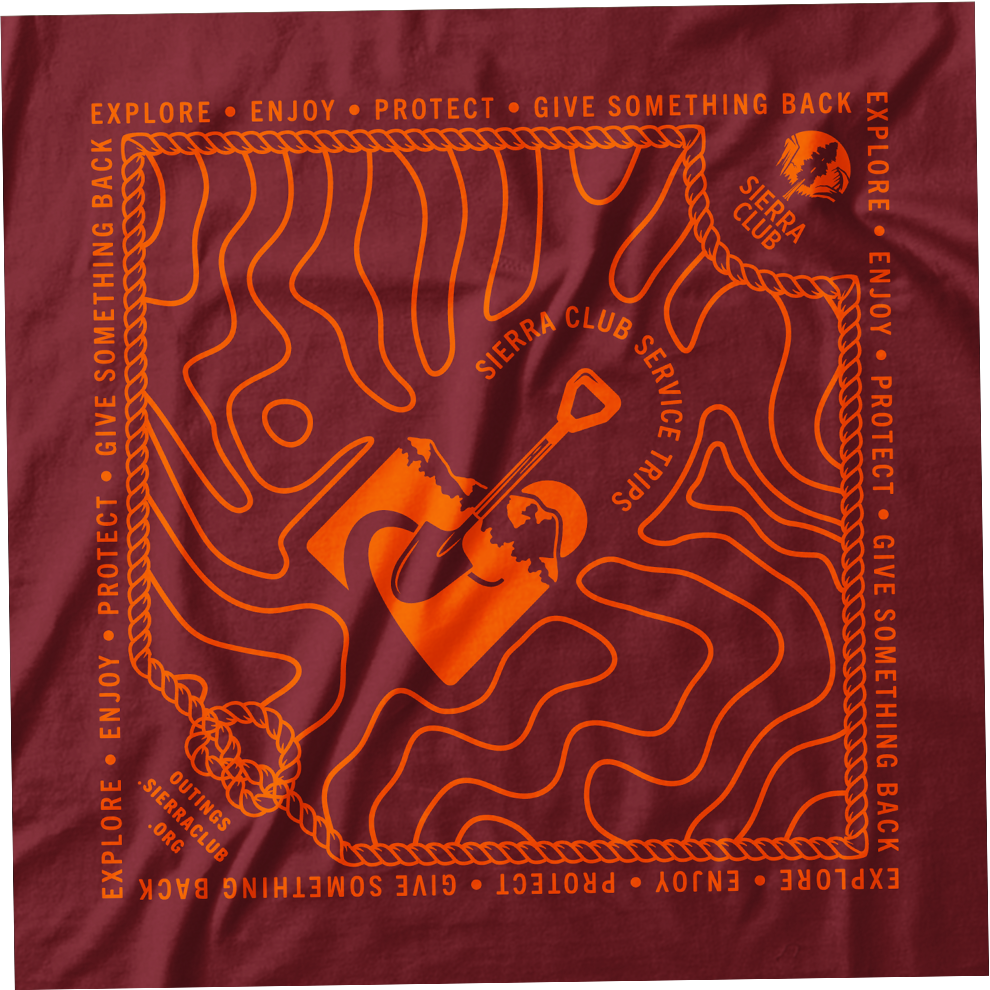 A red bandana with orange outline map of California, the Sierra Club logo, and climbing tools. Includes text with Sierra Club service trips motto: 'Explore, Enjoy, Protect, Give Something Back.'