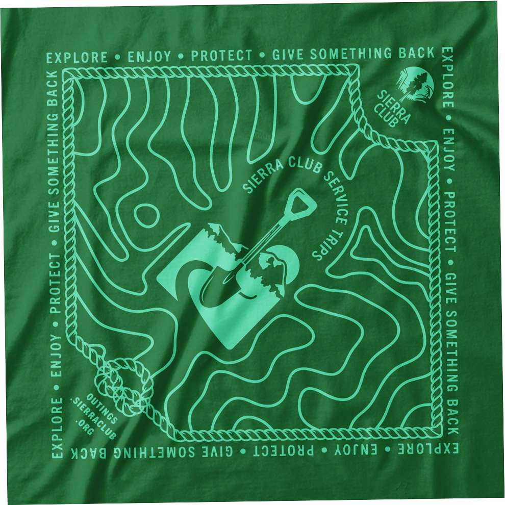 Green bandana featuring a topographic map design with a shovel and mountain graphic in the center. Encircling the map are words like 'Explore,' 'Enjoy,' 'Protect,' 'Give Something Back,' and 'Sierra Club,' along with the Sierra Club logo.