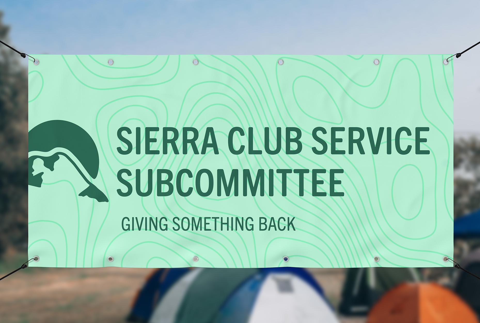 Green banner with topographical lines and text that reads 'Sierra Club Service Subcommittee' and 'Giving Something Back', with an abstract mountain and leaf logo.