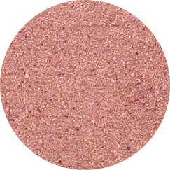 Close-up of a textured, pinkish-colored surface, possibly a makeup blush or eyeshadow.
