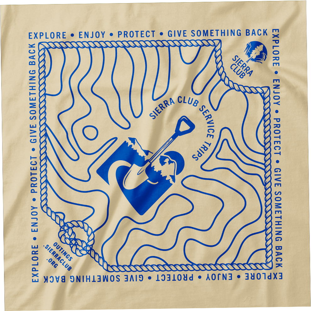Beige bandana with a blue line drawing of topographic mountain lines, a mountain range logo, and the Sierra Club service trips logo. The border has wilderness-themed phrases like "Explore," "Enjoy," "Protect," "Give Something Back," and "Explore" repeated around.