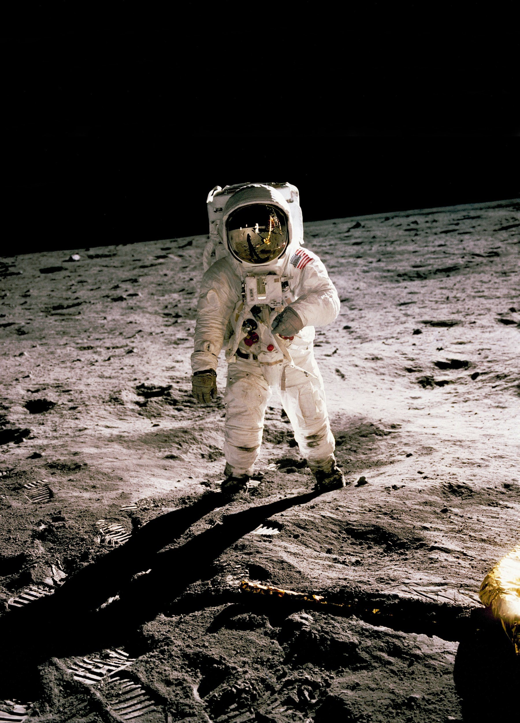 Astronaut walking on the moon's surface in a spacesuit, footprints visible, with Earth in the distant background.
