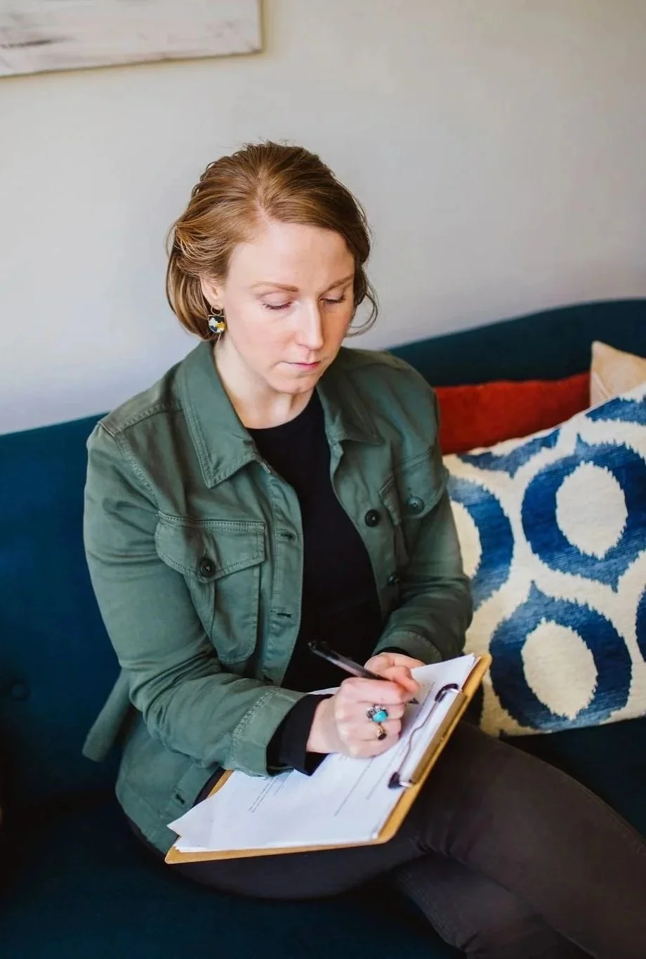 Grief therapist preparing for session in calm therapy space in Bellingham WA