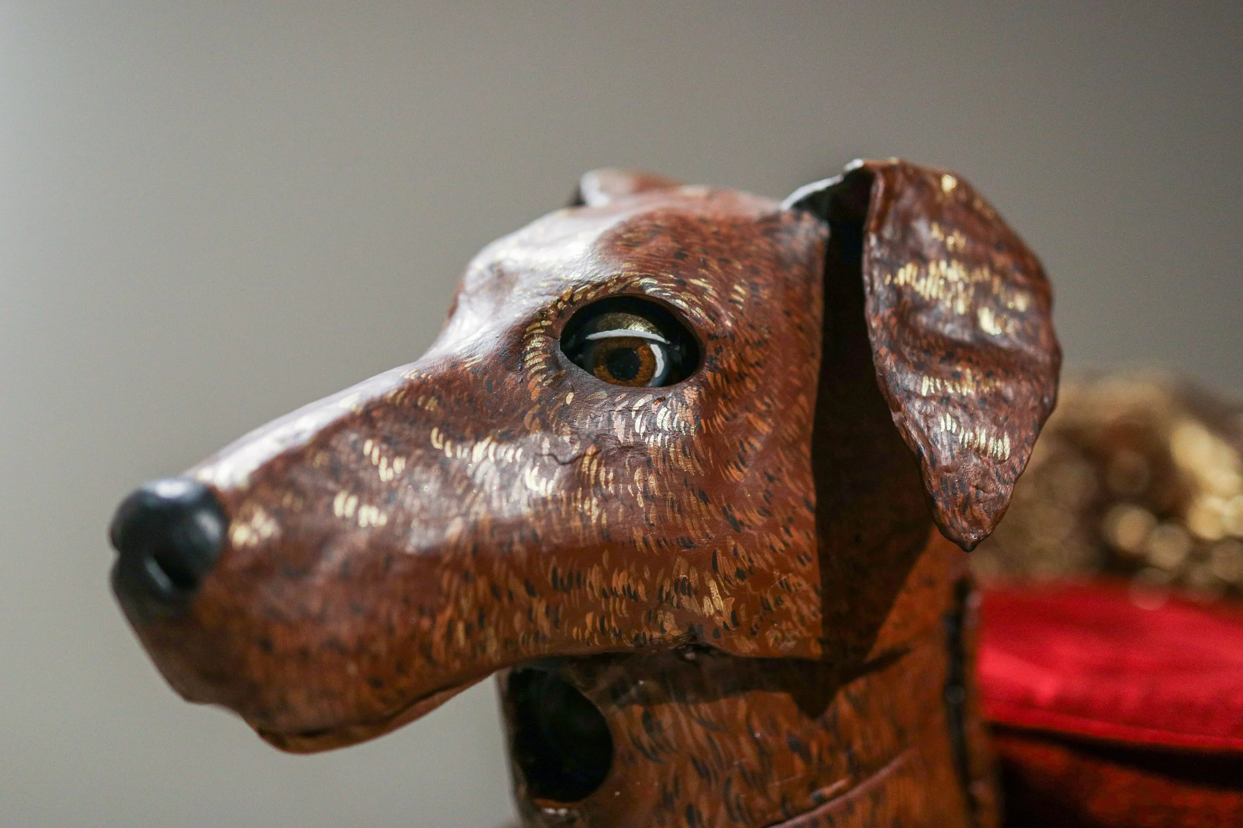 Detail: Becky Sellinger, Give A Dog a Good Name, 2026, Steel, foam, plastic, wood, rope, epoxy sculpt, servo motors, microprocessors, speaker, artist designed/printed PLA components, velvet, paint, 80 x 65 x 31

photo credit: Theo Cote