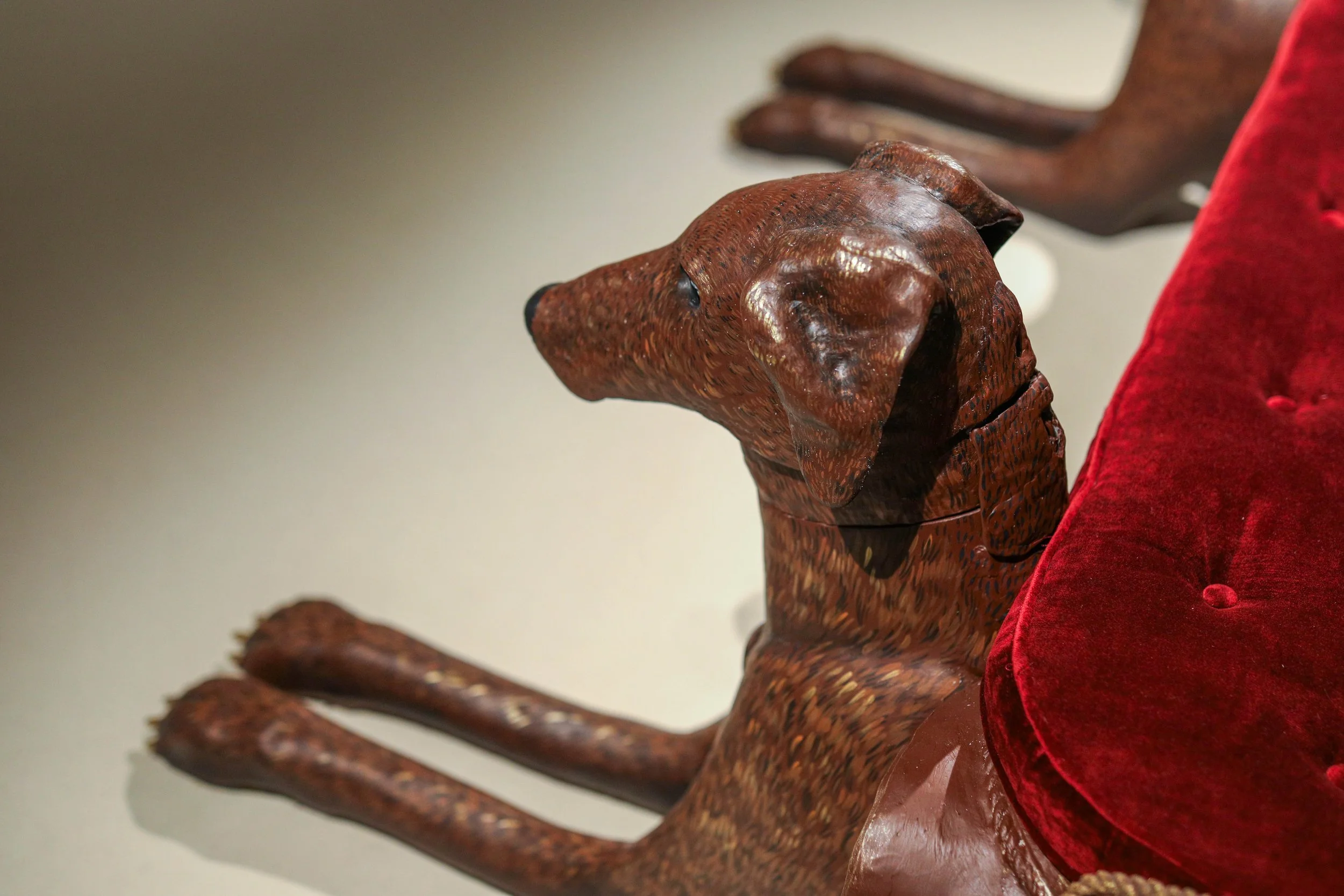 Detail: Becky Sellinger, Give A Dog a Good Name, 2026, Steel, foam, plastic, wood, rope, epoxy sculpt, servo motors, microprocessors, speaker, artist designed/printed PLA components, velvet, paint, 80 x 65 x 31

photo credit: Theo Cote