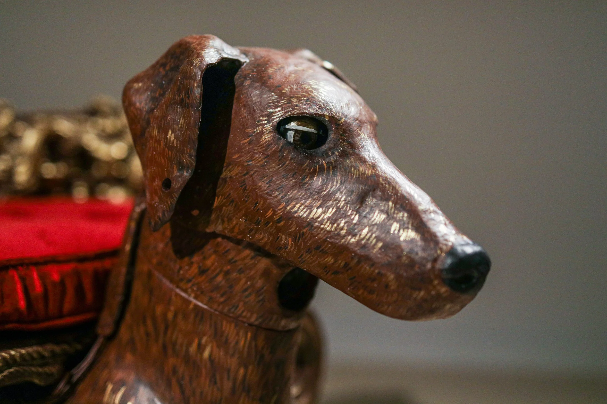 Detail: Becky Sellinger, Give A Dog a Good Name, 2026, Steel, foam, plastic, wood, rope, epoxy sculpt, servo motors, microprocessors, speaker, artist designed/printed PLA components, velvet, paint, 80 x 65 x 31

photo credit: Theo Cote