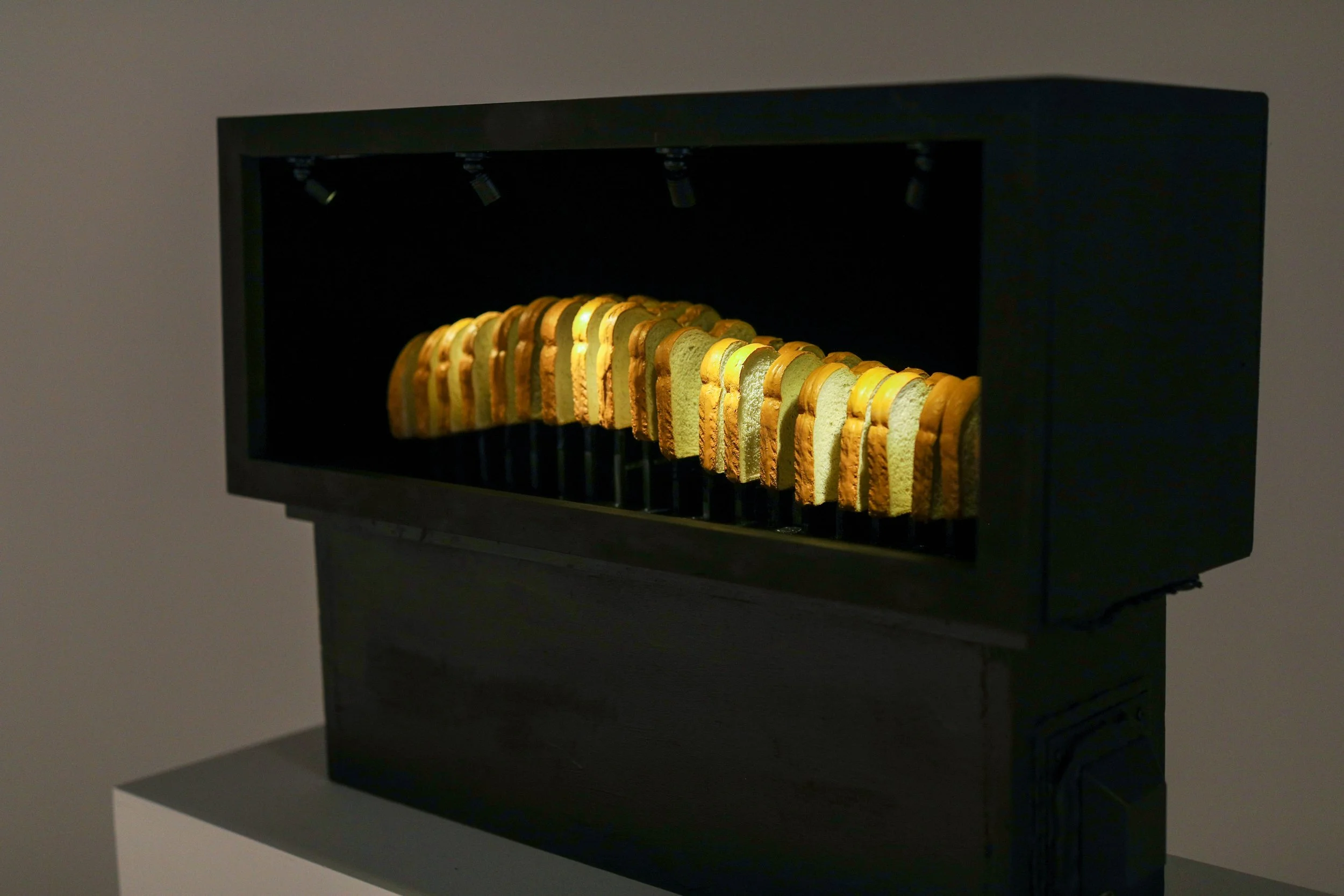 Becky Sellinger, Best Thing Since Sliced Bread, 2026, a loaf of bread, plywood, velvet, paint, felt, silicone, steel, lasercut acrylic, motor, artist designed/printed PLA components, epoxy, lacquer, 30 x 22 x 11

photo credit: Theo Cote