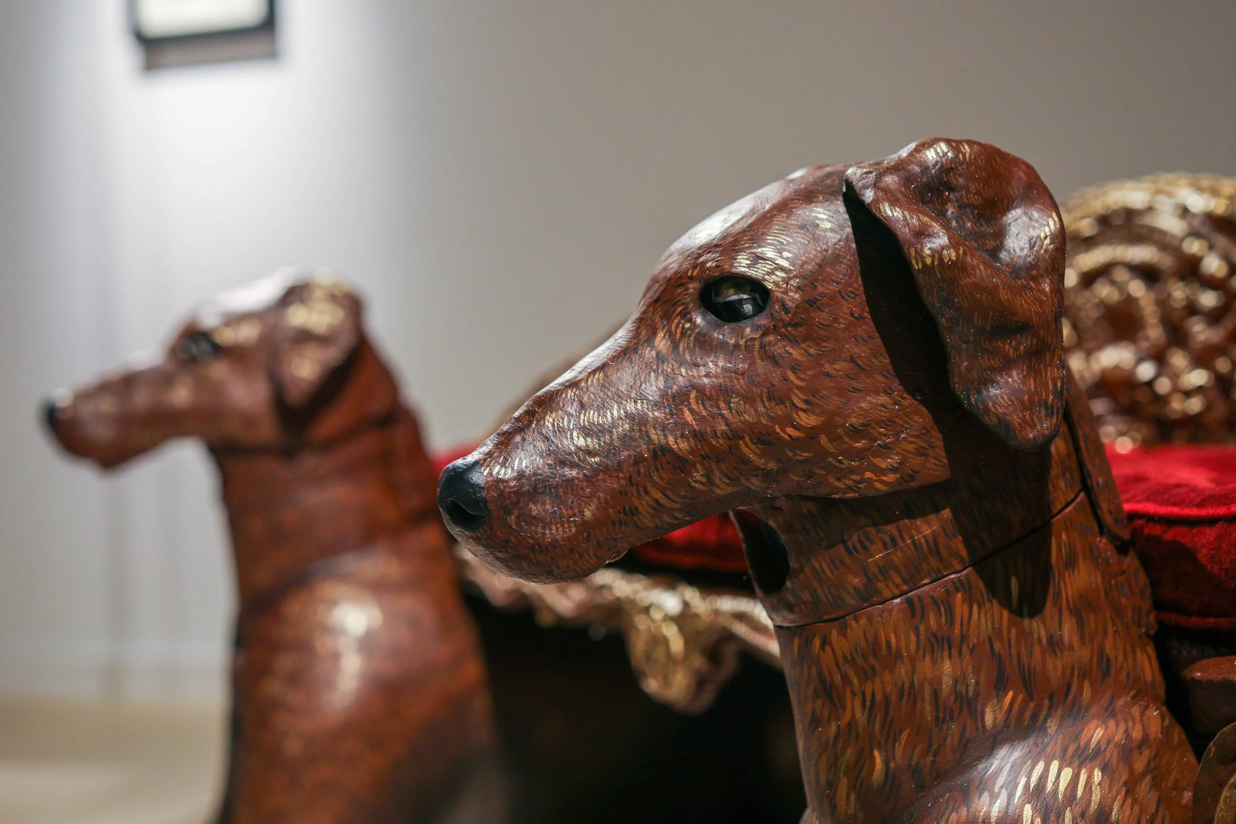 Detail: Becky Sellinger, Give A Dog a Good Name, 2026, Steel, foam, plastic, wood, rope, epoxy sculpt, servo motors, microprocessors, speaker, artist designed/printed PLA components, velvet, paint, 80 x 65 x 31

photo credit: Theo Cote