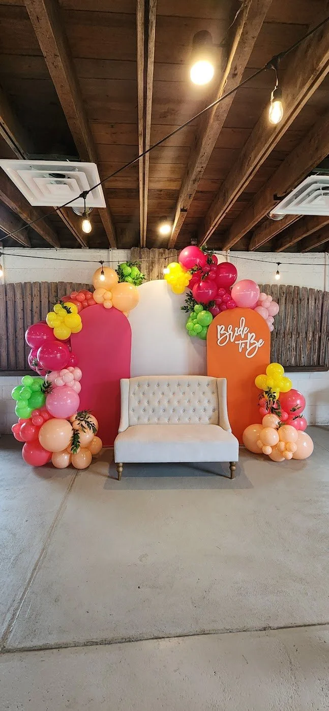 colorful bride to be with DIY arches