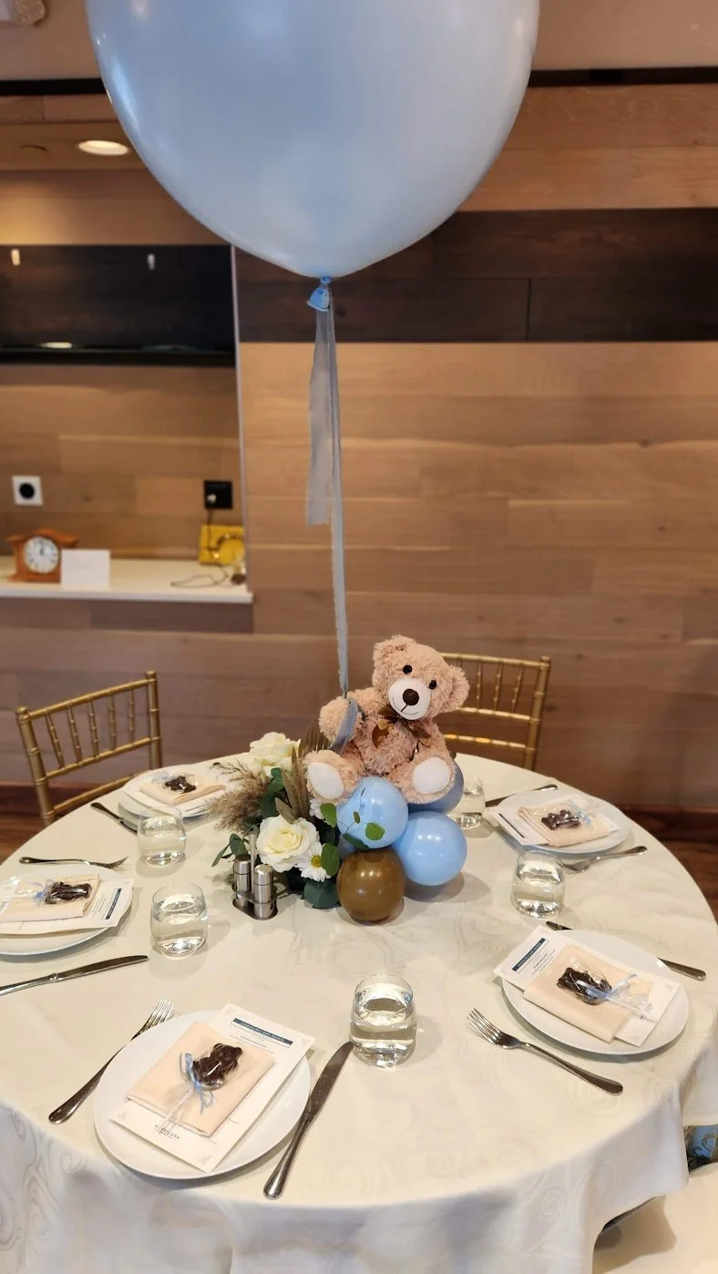 Bear with helium 24 and floral centerpiece.jpg