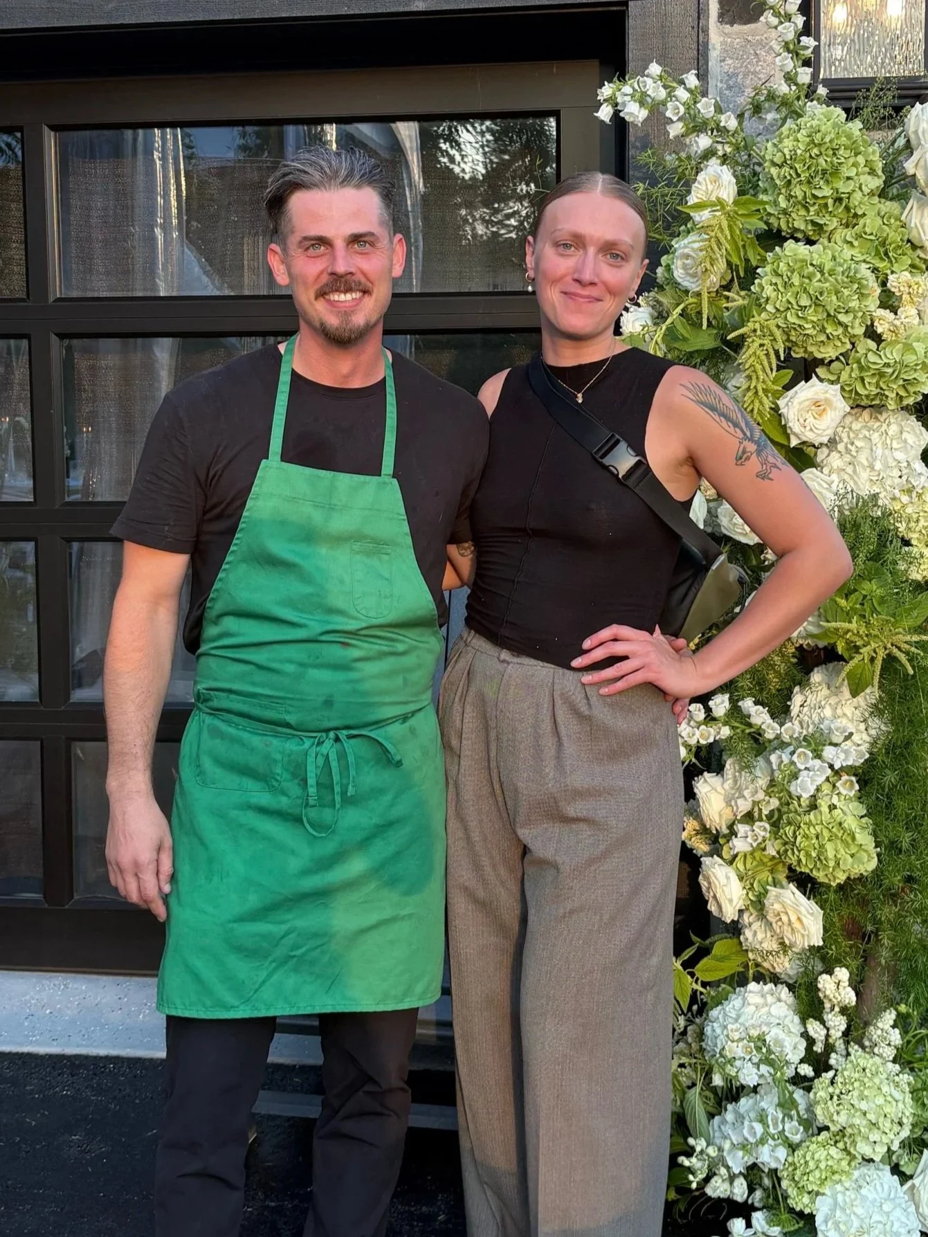David and Emma stand side by side for a picture moment during a busy September wedding