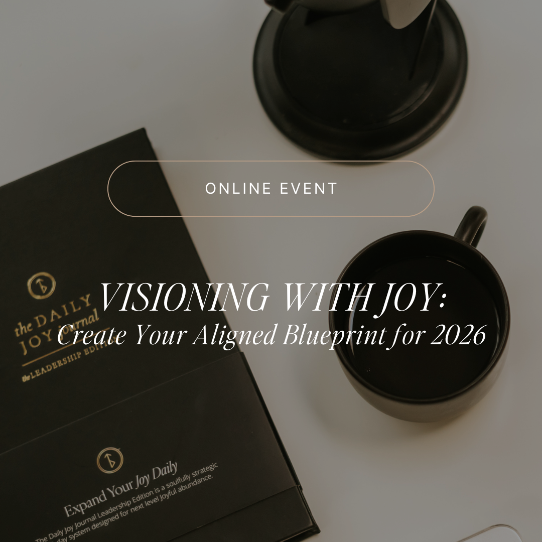 Top-down view of a black planner and two black coffee mugs on a white surface, with an overlay text indicating an online event titled 'Visioning with Joy: Create Your Aligned Blueprint for 2026'