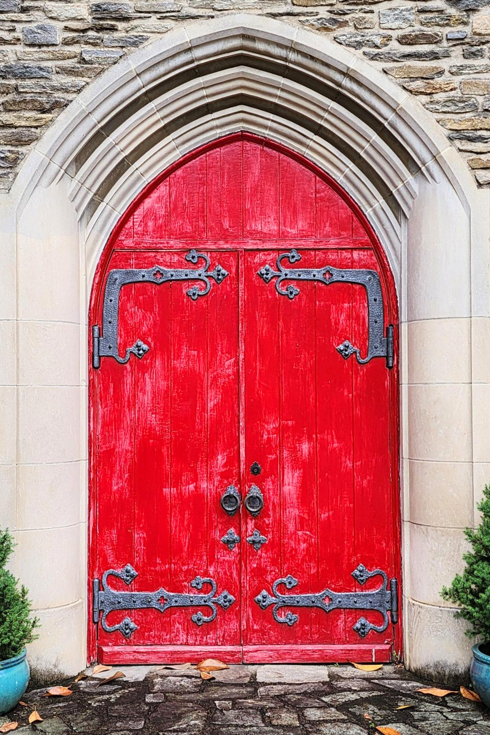 Red doors in a old stone church