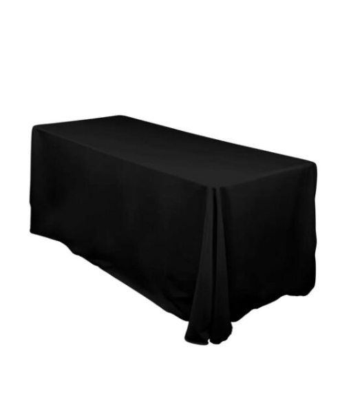 A rectangular table covered with a black tablecloth.