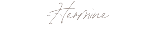 Stylized handwritten text that says '-Hermine'.