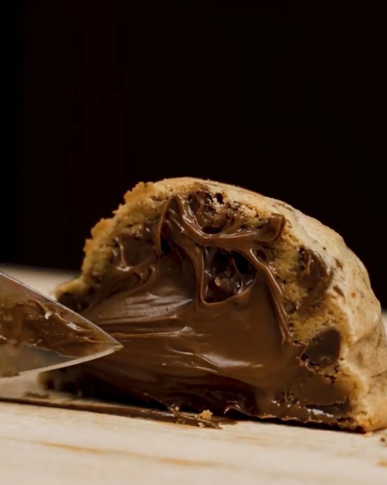 Cut into a molten Nutella center. The moment every cookie lover waits for. 🍫