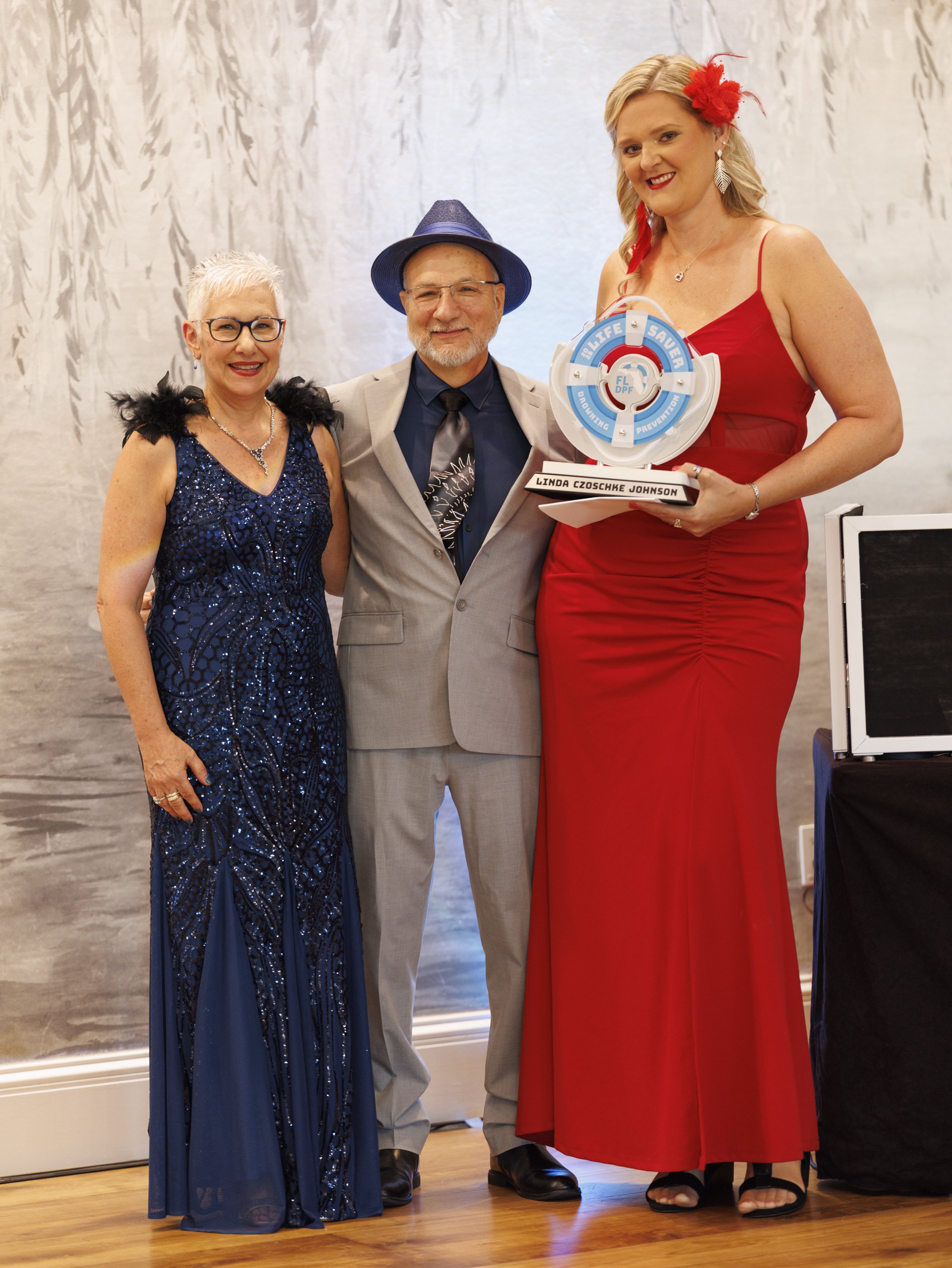 Terri Rich Linda with Award.jpg