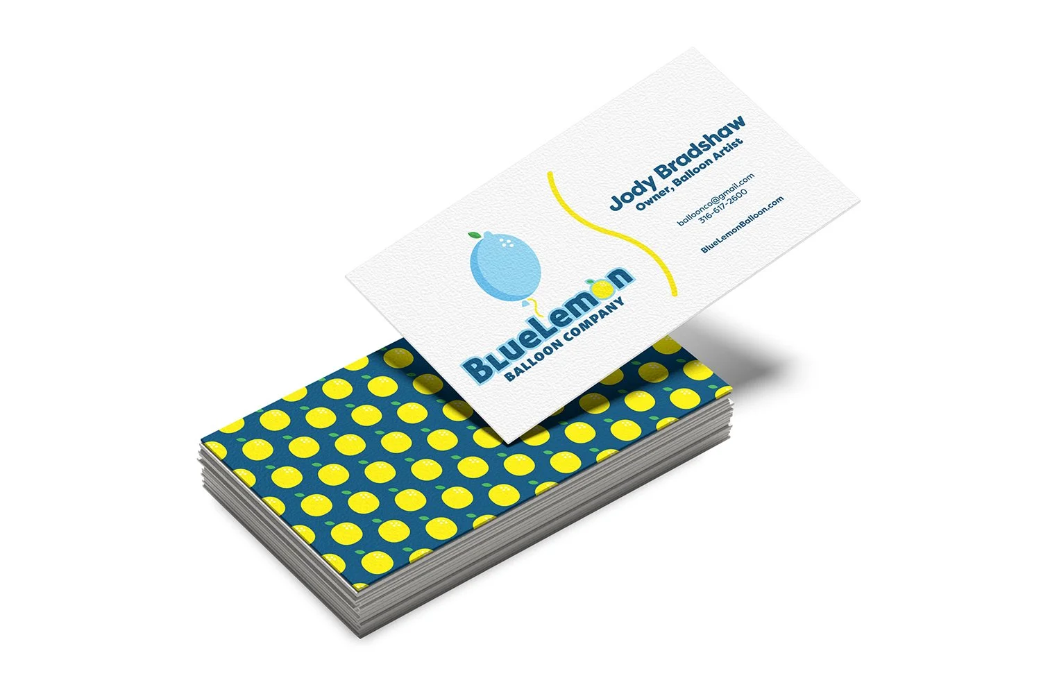 A stack of business cards for Blue Lemon Balloon Company, with one card on top displaying the owner's contact information and a blue lemon balloon logo, and the backside featuring a pattern of yellow lemons on a blue background.