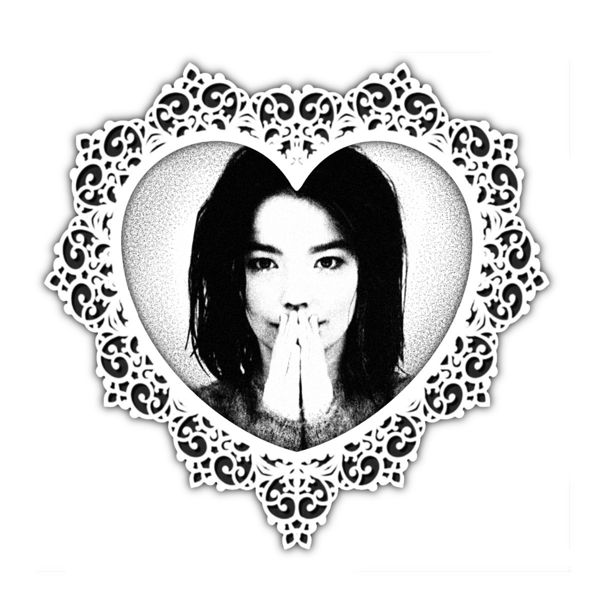 Black and white portrait of a woman with long dark hair inside an ornate white heart-shaped frame with intricate patterns.