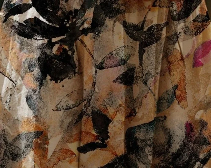 Abstract floral pattern with dark and colorful leaves on fabric